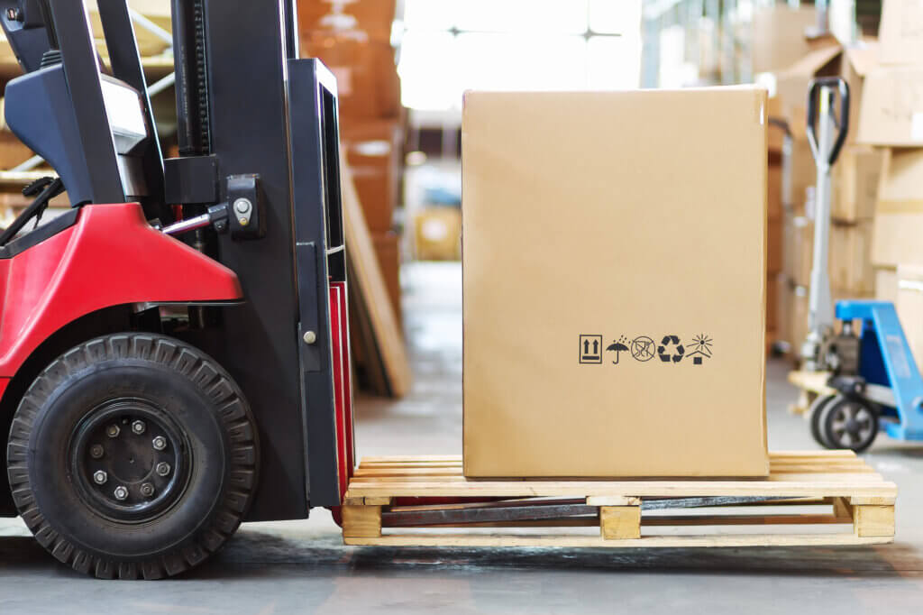 Forklift Checks - A Forklift Lifting a Box