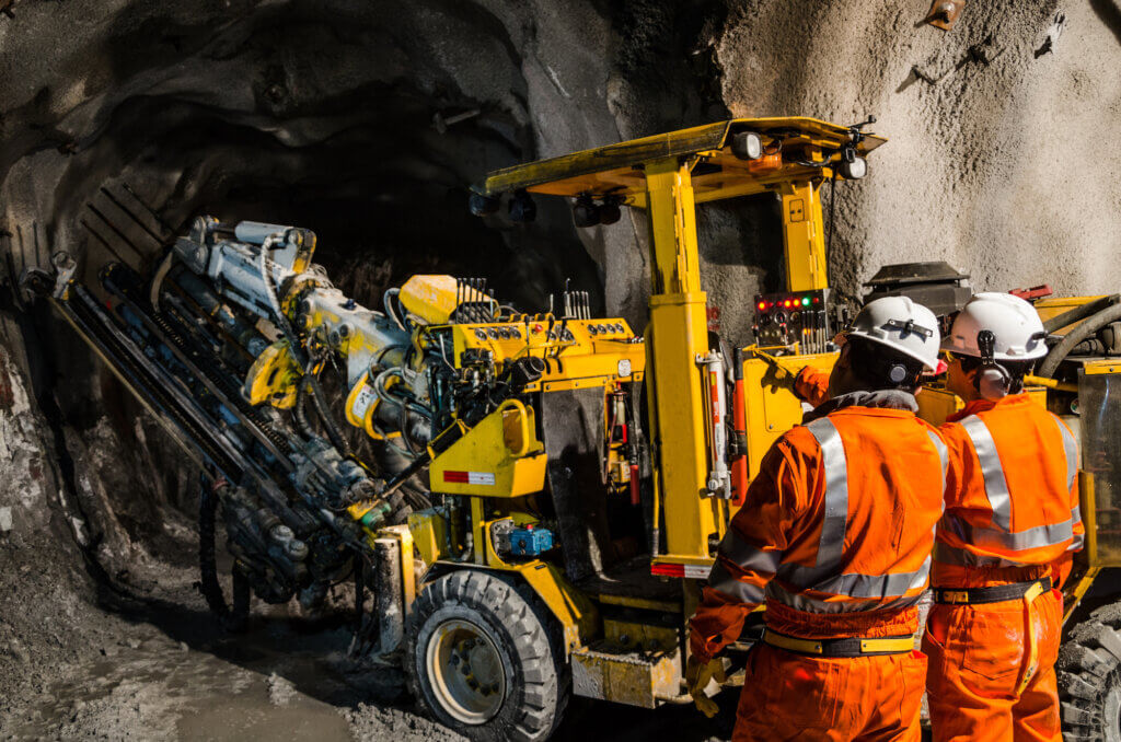 How to Improve Mining Equipment Maintenance and Safety: Mechanic working with mining machines