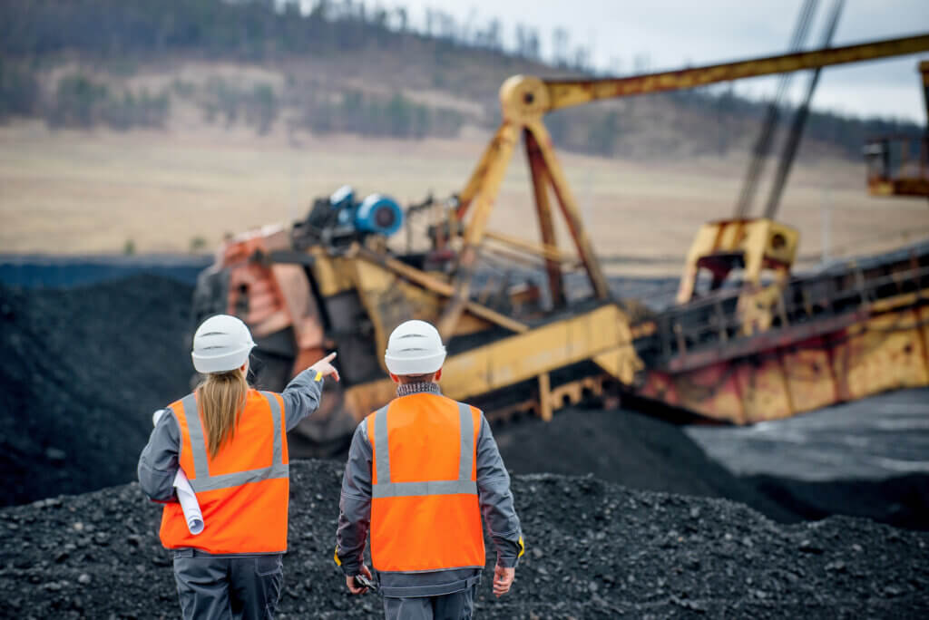 two coal mine workers during mining maintenance process