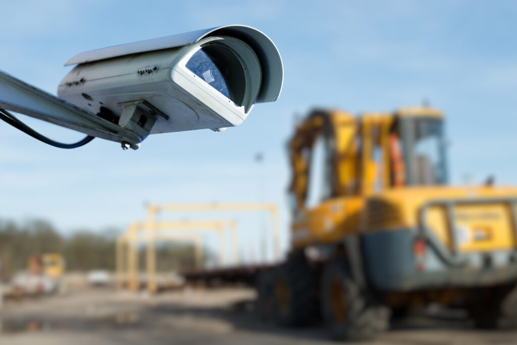 A construction site with security cameras and IoT security technology